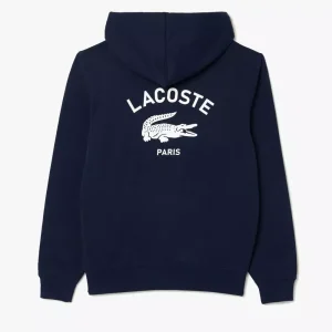 Hoodie Lacoste navy dengan logo buaya dan tulisan 'Lacoste Paris' di bagian belakang